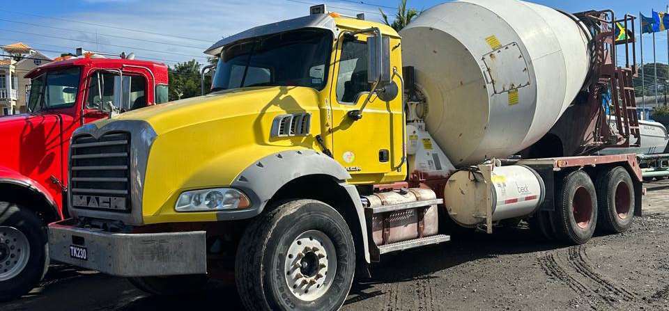 Yellow concrete mixer truck